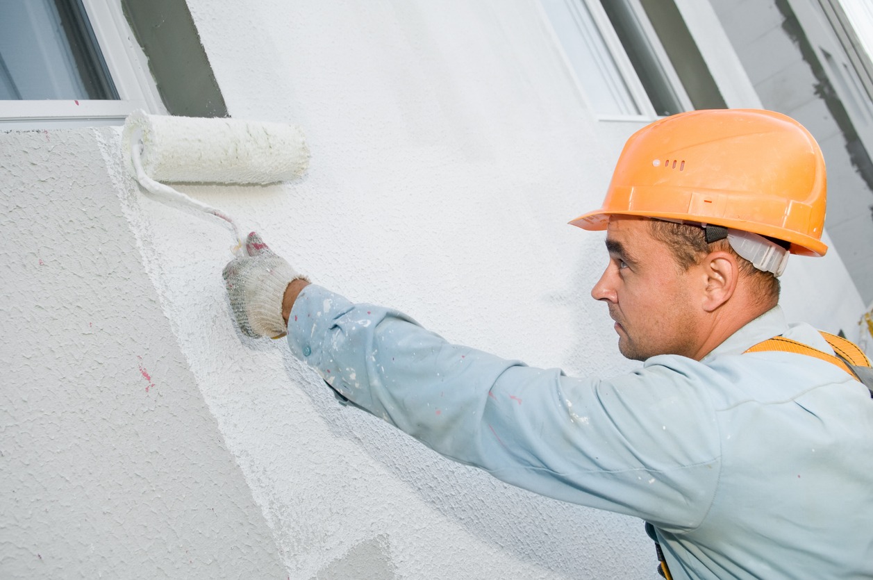 builder facade painter at work