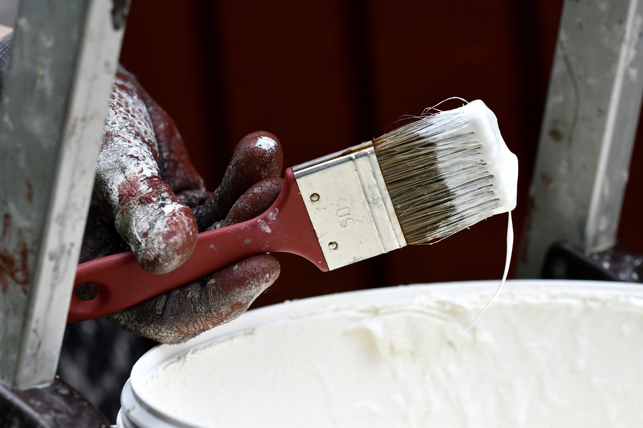a man applying white color