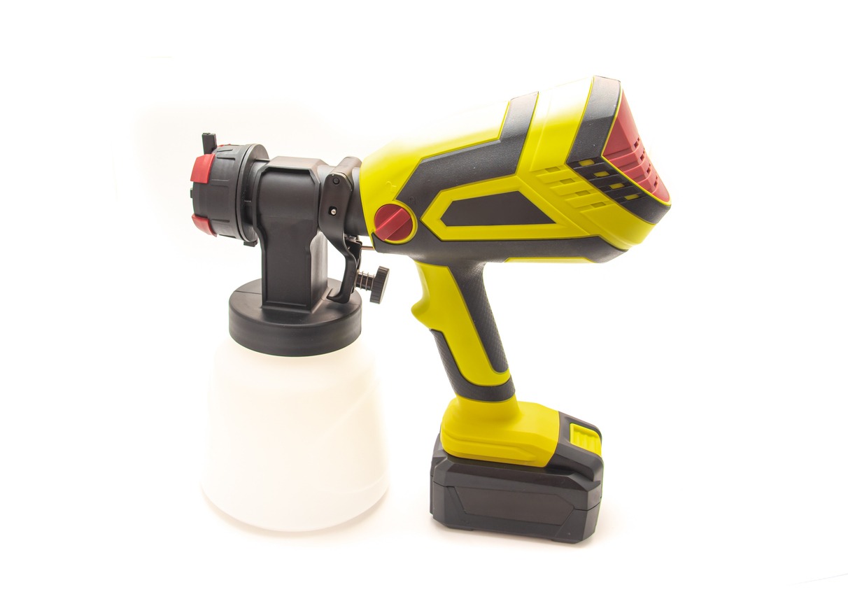Side view cordless paint sprayer gun with battery isolated on white background, adjustable nozzle, flow adjustment, quick release knob, switch trigger, spray bottle