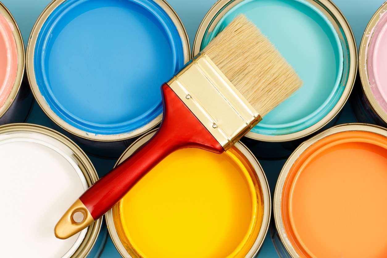 Paint cans and paint brushes and how to choose the perfect interior paint color and good for health