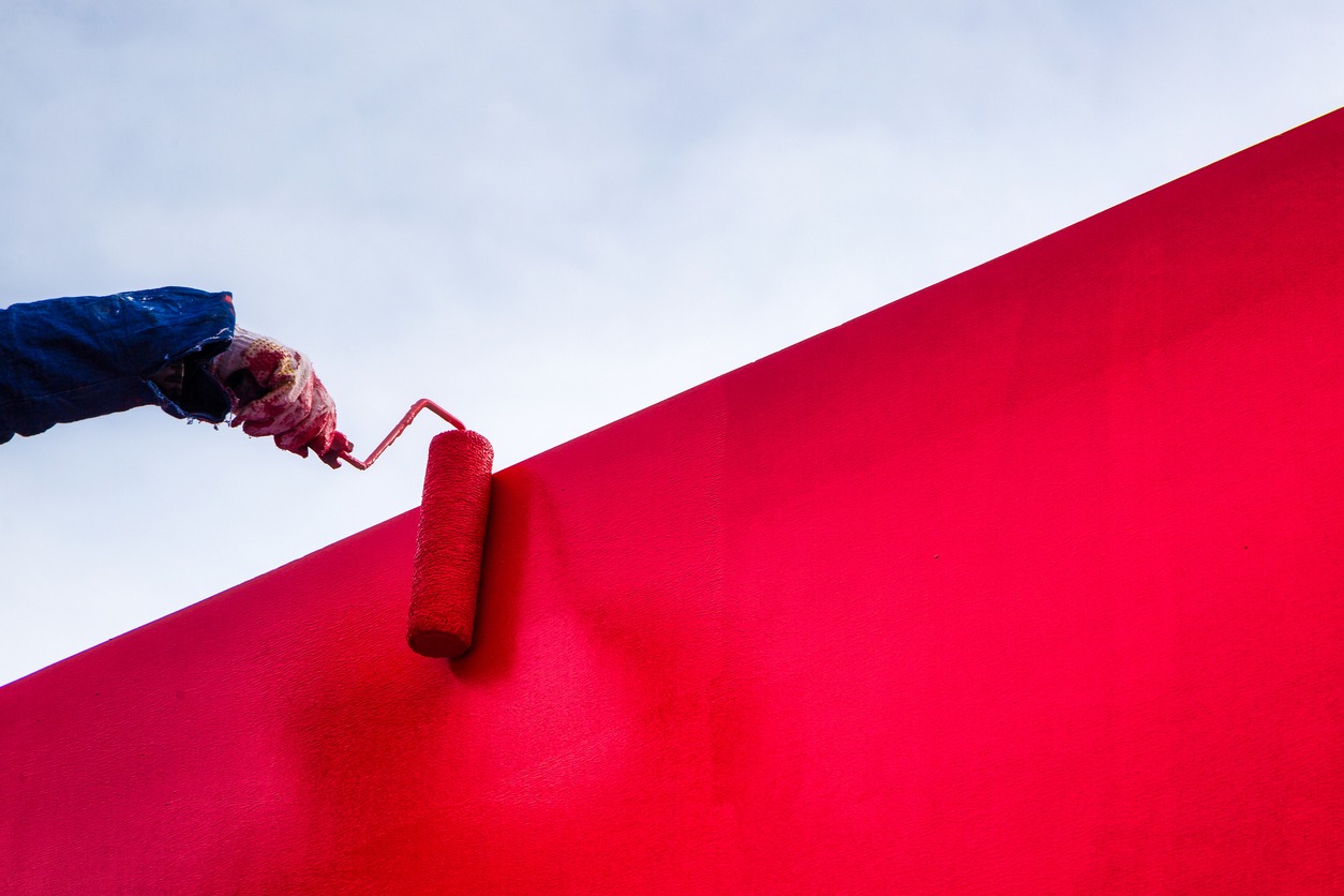 Red latex paint stucco wall