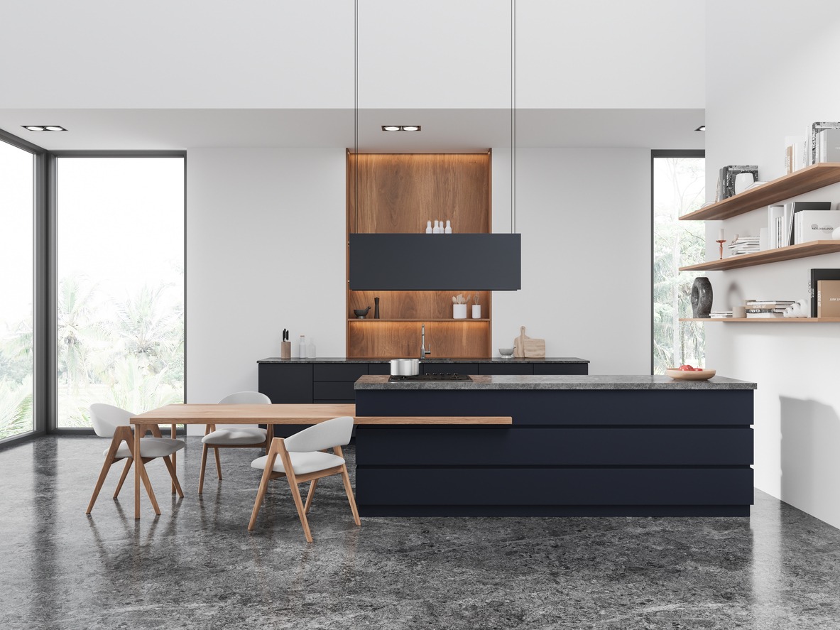 Modern home kitchen interior with eating table and bar island, window