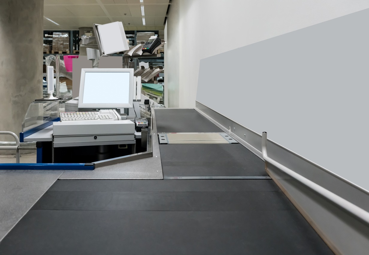 Empty cash desk with payment terminal in supermarket