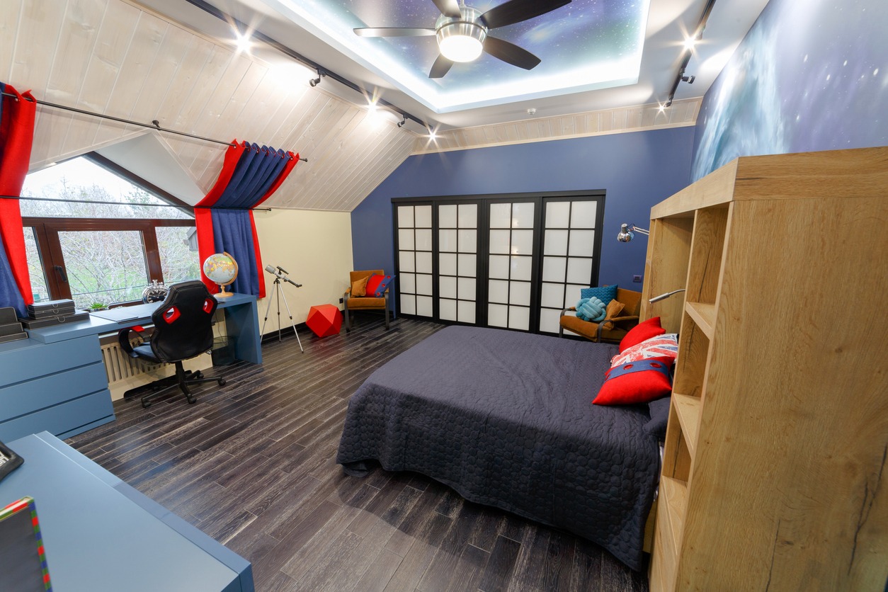 The interior of the children's room, the room of the teenager in red blue tones.