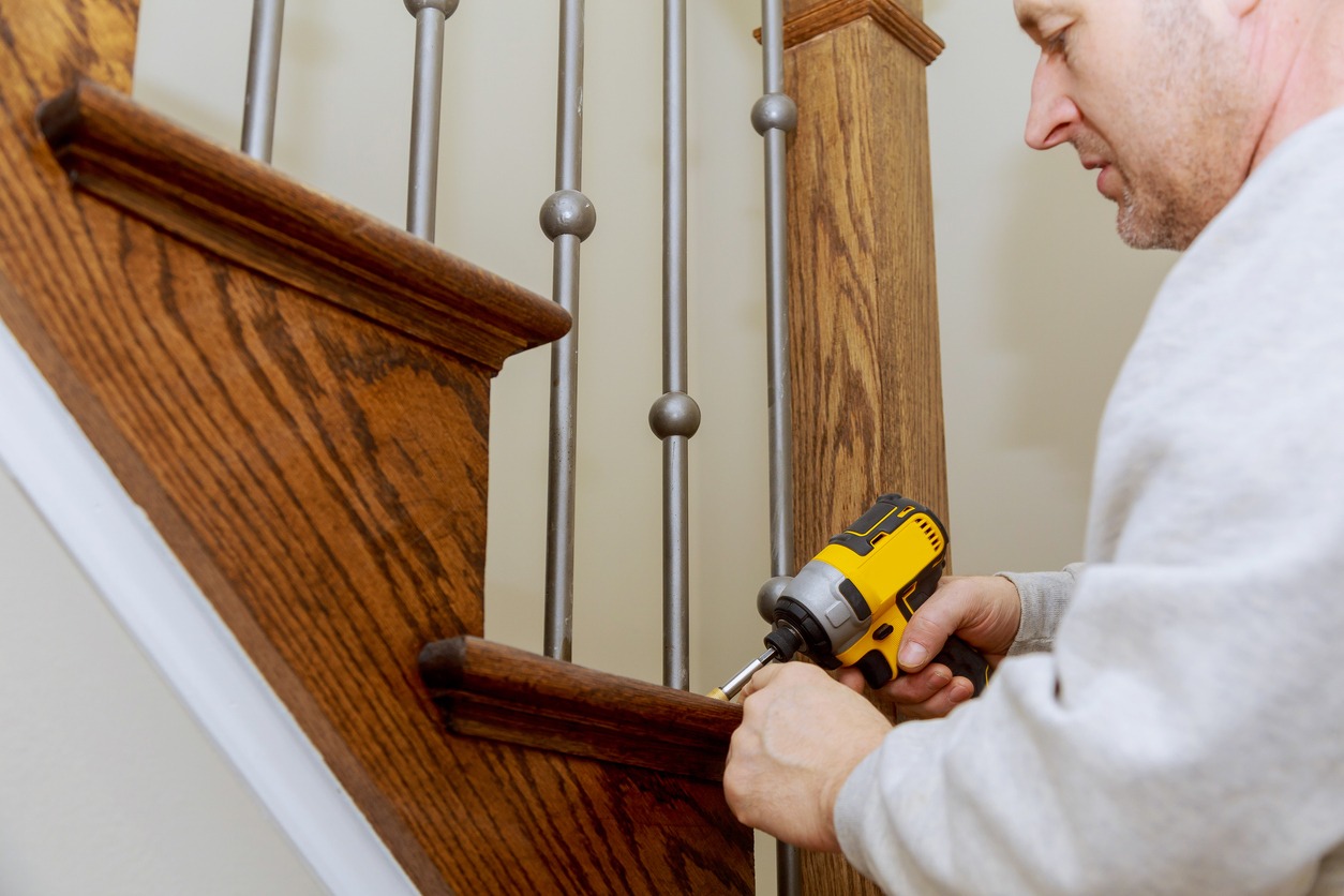 Wooden planks around pole stairs handrails renovation